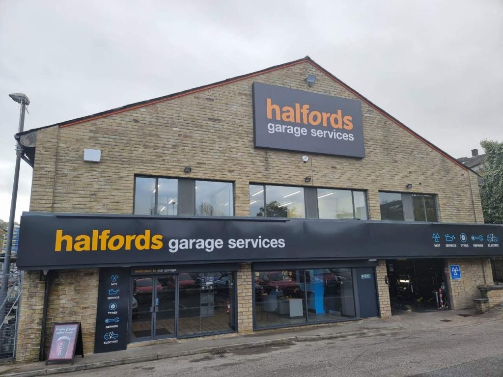 Halfords garage services store building with large signage